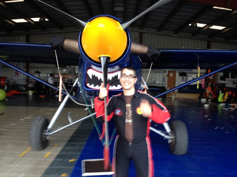 Skydiver descending through cloud layer